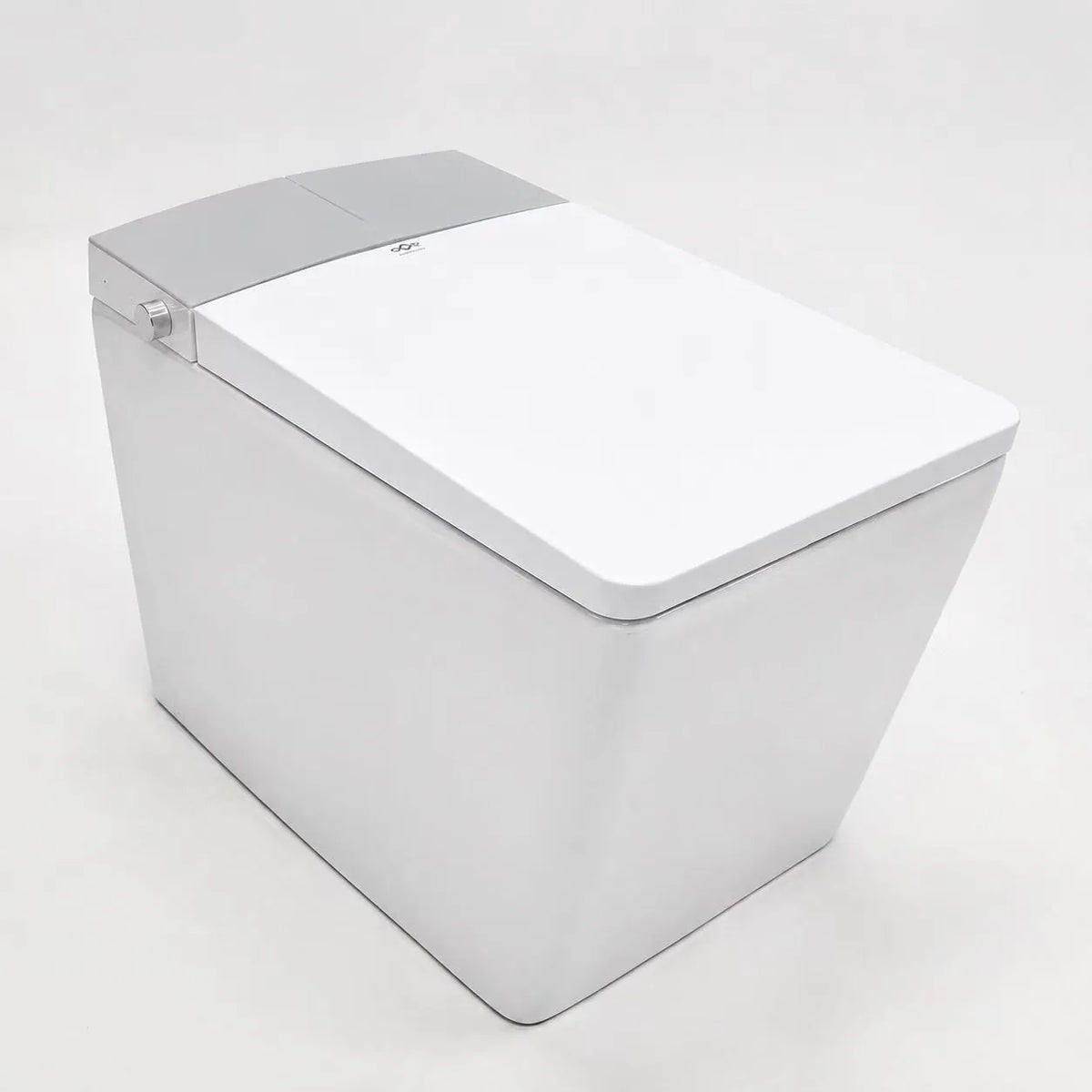 Toilette japonaise lavante Nelsmann KAKU blanc, design carré monobloc, vue de 3/4 avec abattant fermé et capot arrière gris clair