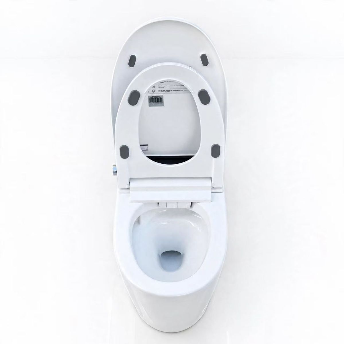 Texte alternatif : WC japonais Nelsmann Hikari vu de dessus avec abattant et lunette ouverts, cuvette en céramique blanche
