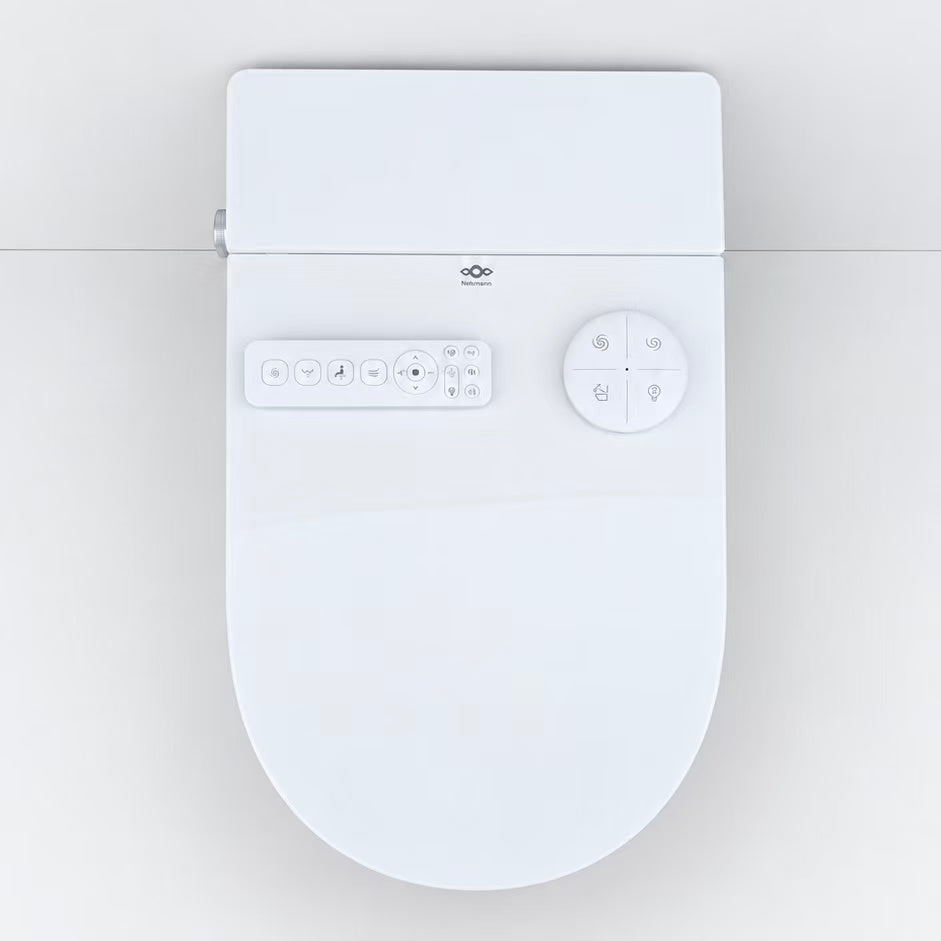 vue du haut du toilette japonais suspendu avec telecommandes d'utilisation